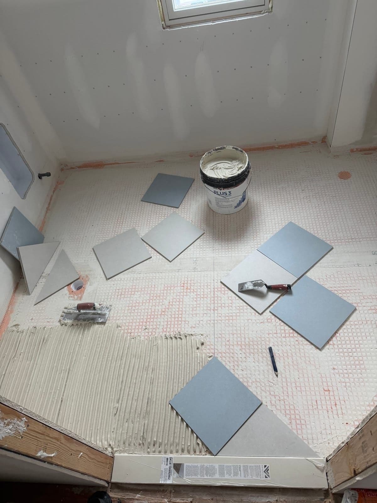 Custom tile floor pattern installation